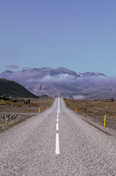 Iceland, Europe: view of the breathtaking Icelandic landscape from the road. Trip on the road, asphalt, book cover, symbolic, freedom, travel 
