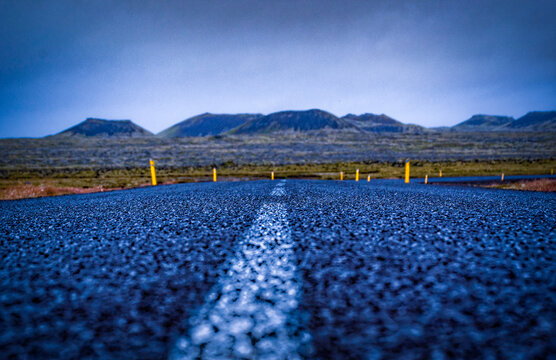 Iceland, Europe: view of the breathtaking Icelandic landscape from the road. Trip on the road, asphalt, book cover, symbolic, freedom, travel 