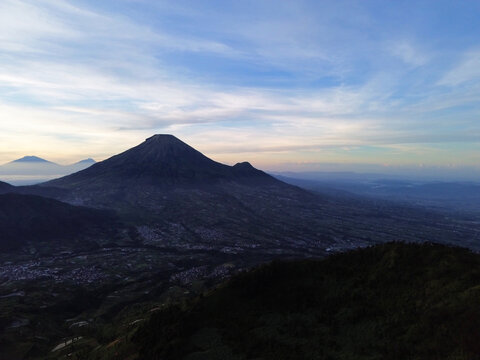 Aerial Drone View of Sunrise Between Mountain Ranges with Peaceful Morning Landscape	
