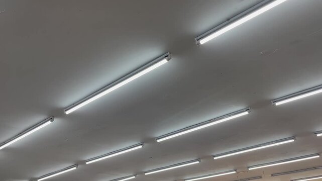 Diagonal perspective of triple parallel linear LED lights on ceiling