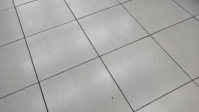 Top down view of ceramic floor tiles grid pattern