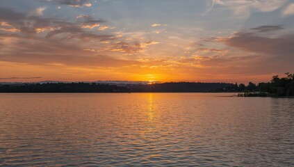 Obraz premium Sunset Reflection on Calm Lake with Colorful Clouds and Silhouette of Trees