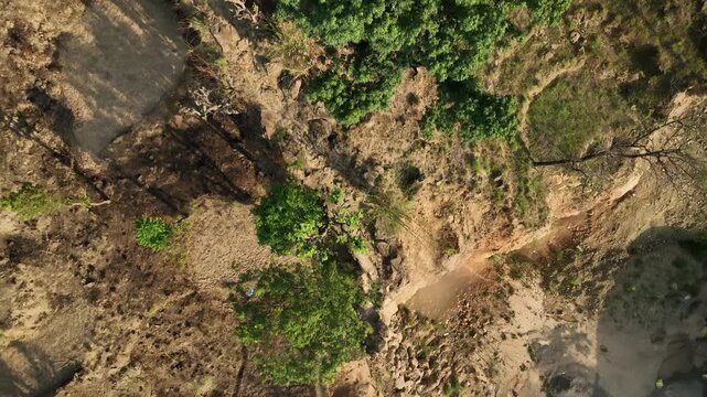 Severe soil erosion on a mountain slope next to a highway in India in the Himalayas Kullu Valley
