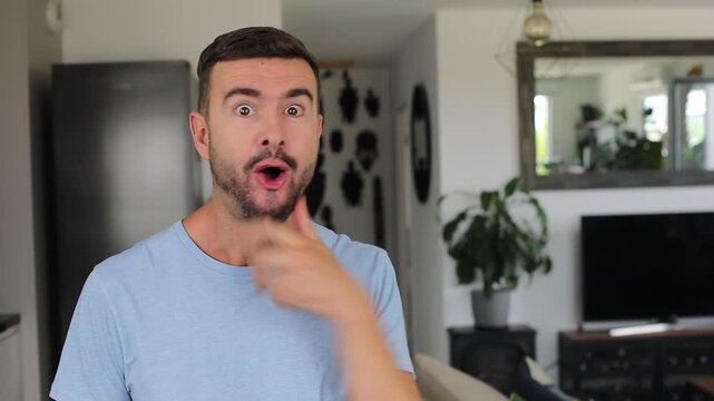Happy man expressing absolute shock and joy after hearing amazing news
