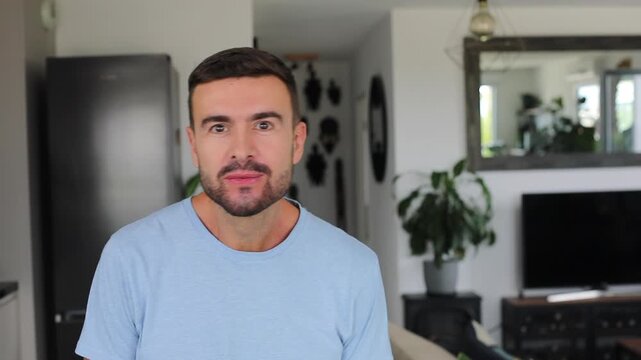 Happy man expressing absolute shock and joy after hearing amazing news