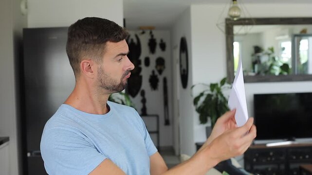 Man trying to understand the correct orientation of a document 