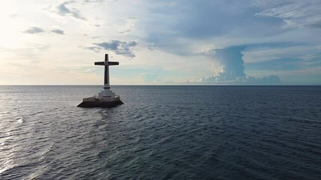 Aerial view of the Sunken Cemetery standing in the sea off the coast of Catarman, Camiguin, Philippines.