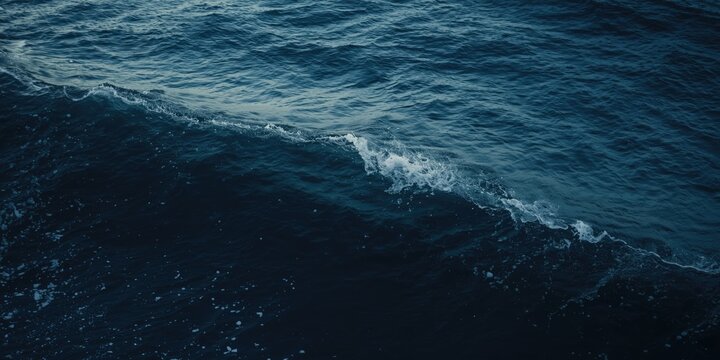 Dark Ocean Waves Under Soft Lighting