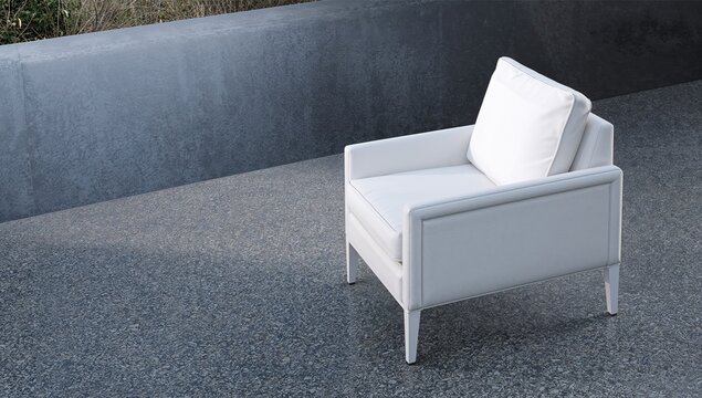 Modern White Armchair on Gray Textured Floor Outdoors