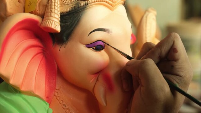 Artist paints an Idol of Lord "Ganesha", ahead of "Ganesha Chaturthi" festival in India.