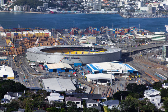 Hnry Stadium and waterfront, Wellington, New Zealand. Sponsor's sign being installed after change from Sky Stadium. April 24, 2026. Wadestown in foreground, Oriental Bay in distance. View from Ngaio.