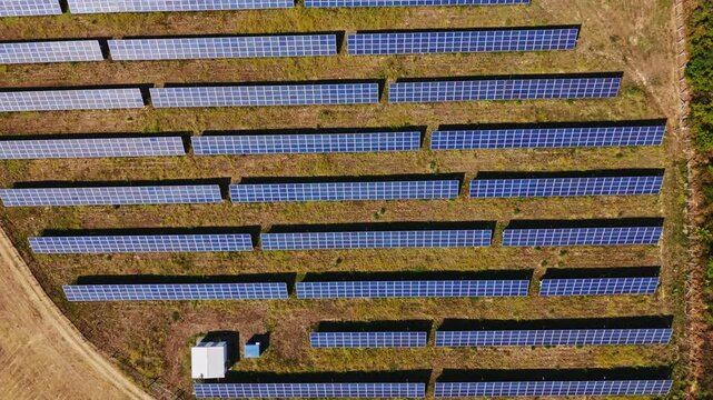 Aerial view of rows of photovoltaic panels in a solar farm located in Beocin, Vojvodina, Serbia.