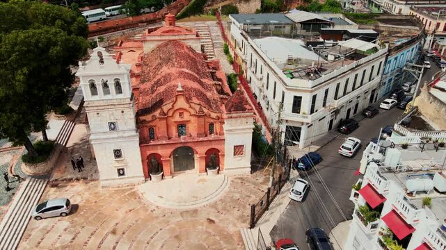 Aerial view of the historic Catedral Castrense de Santa Barbara with its distinctive red roof and white bell tower in the colonial zone of Santo Domingo, Distrito Nacional, Dominican Republic.