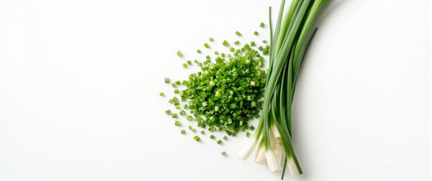 Chopped Green Onions Piled Near Fresh Whole Scallions on White Background