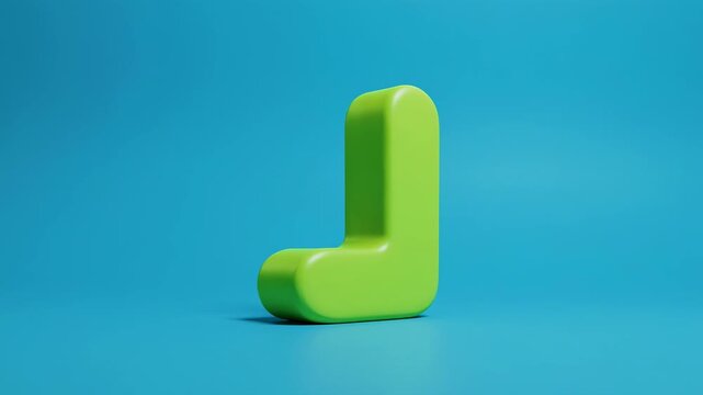 Green Letter L rotating slowly against a bright blue studio background with soft shadows