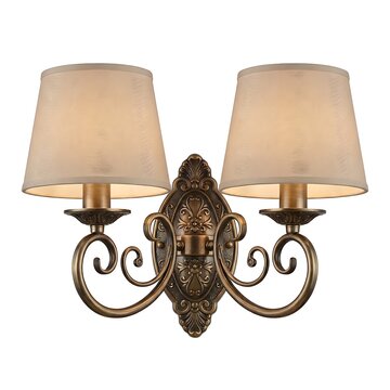 Elegant double wall sconce with ornate bronze finish and beige fabric shades isolated on white background