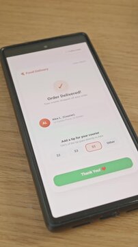 Vertical footage showing close-up of user tapping to add digital tip for delivery driver in food ordering application on smartphone screen