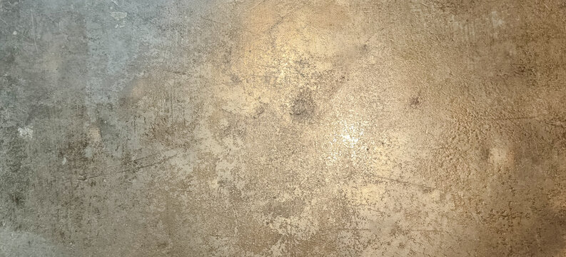 Scratched metallic bronze plate surface texture background close up macro