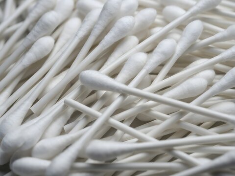 Close-up of White Cotton Swabs in a Pile for Personal Care