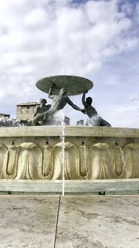 Valletta triton fountain splashing water in malta