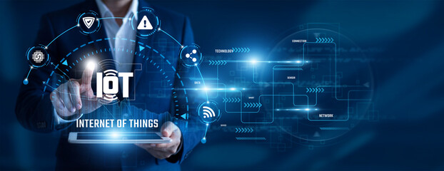 IoT Engineer using tablet analysing Internet of Things data. Connected devices, smart networks, sensor technology, real-time monitoring, automation systems, digital innovation. © Shevon