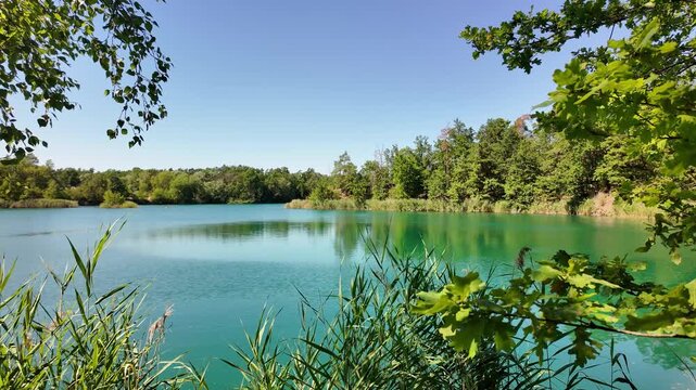 idyllic lake landscape near Pretzien, Saxony-Anhalt, Germany; three former quartzite quarries, deep lake, blue lake, quarry lake, popular diving area 