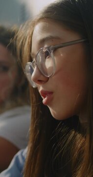 Teacher Sit beside Discouraged Teenage Girl, Offering Calm Guidance, Emotional Reassurance before School Day Continues. Mentorship, Student Care, Psychological Safety, School Culture. Vertical Shot.