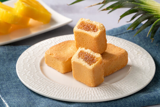 Traditional Taiwanese pineapple cake pastry served on ceramic plate.
