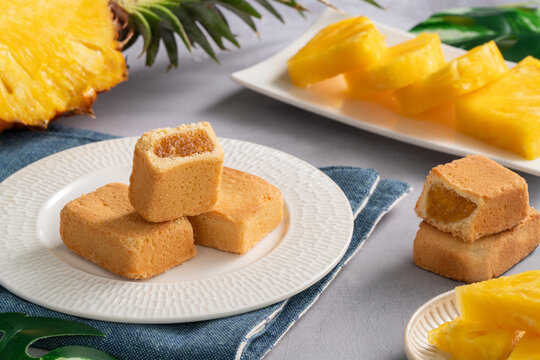 Traditional Taiwanese pineapple cake pastry served on ceramic plate.