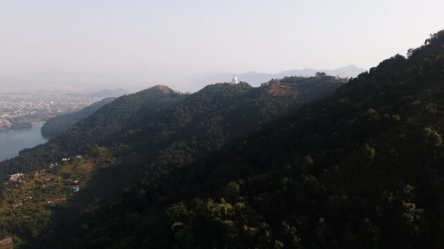 Panoramic drone footage of buddhist white Pagoda at Phewa lake in Nepal