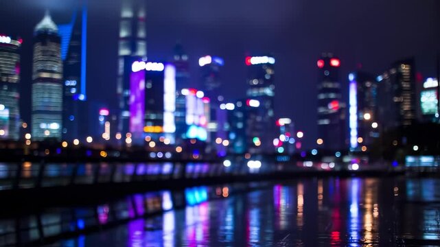 City skyline at night with blurred lights and reflections in the water. Buildings, lights