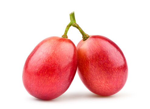 Close-up two red grapes isolated on white.