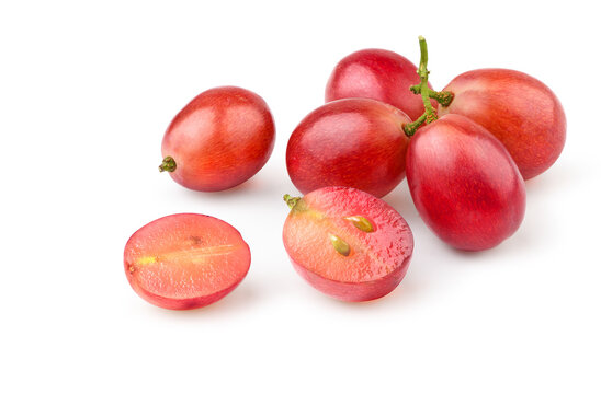 Red grape with cut in half isolated on white.
