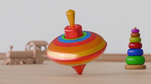 Colorful spinning top toy in motion with wooden train and stacking rings