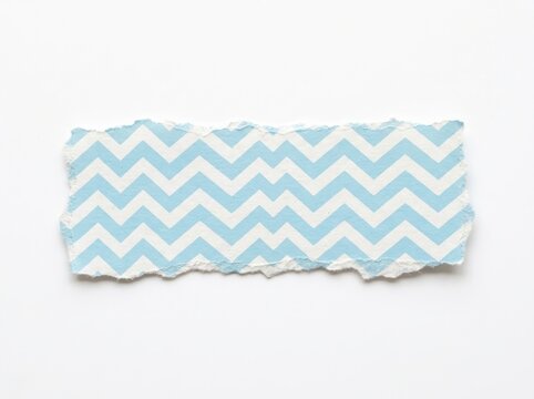 Torn piece of blue and white chevron pattern paper isolated on white background