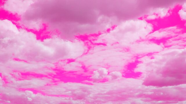 A stunning, highly saturated pink sky fills the frame with dramatic, voluminous clouds. This ethereal backdrop evokes feelings of dreaminess and fantasy. Perfect for romantic or vibrant design project