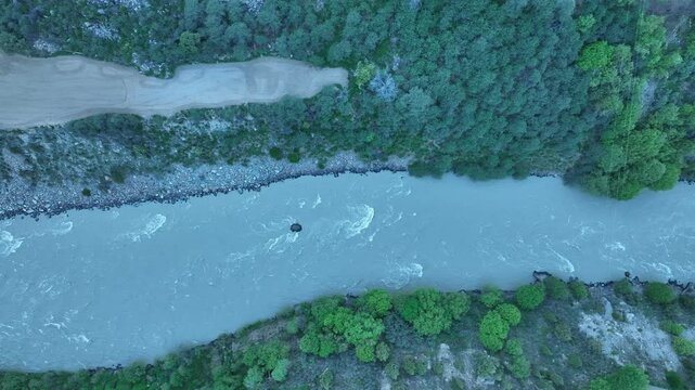 Aerial view of a Himalayan mountain river and rapids near Jispa Lahaul Valley shot by a drone. Shot by a drone flying over Bhaga river