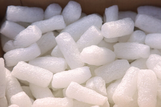White expanded polystyrene foam pieces in cardboard box