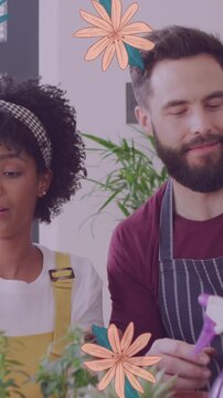 Animation of flowers over happy diverse couple planting plants together