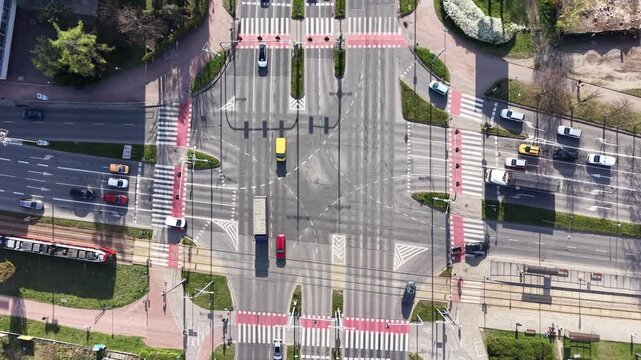 Modern urban intersection with road markings and vehicles