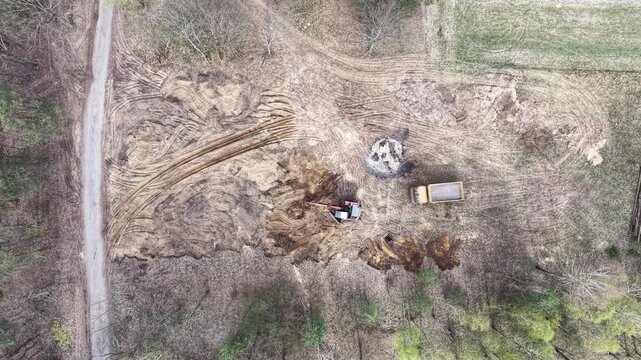 Big machines working to level terrain