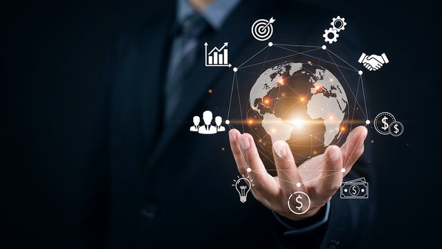 Businessman holding glowing digital globe with network connections and business icons representing global strategy