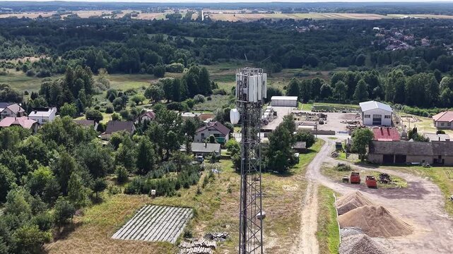 Telecommunication infrastructure tower in green countryside