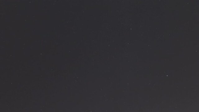 Dark celestial backdrop with countless small stars creating a vast cosmic view, perfect for astronomy or space themes