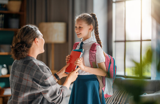 Happy Mother Sending Daughter to School on First Day, Morning Family Routine at Home