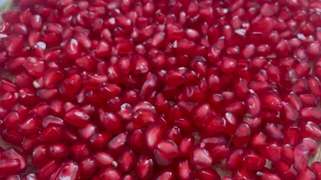 Fresh Red Pomegranate Seeds Close Up with Juicy Ruby Arils and Natural Texture