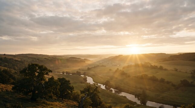 Sunbeams breaking through clouds over rolling hills and countryside valley
