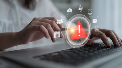 Red warning triangle representing a cybersecurity threat or data breach alert, surrounded by...