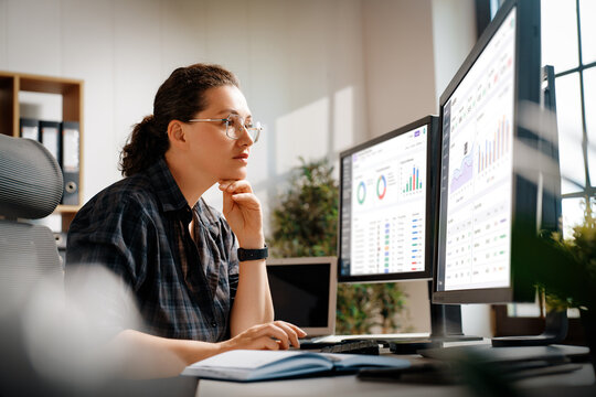 Focused Business Analyst Working on Financial Reports