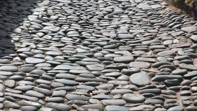 Walking along an old cobblestone road